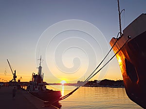 Fishing boat in sunset in the harbor