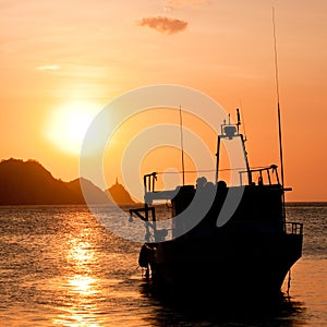 Fishing boat at sunset in Taganga, Colombia photo