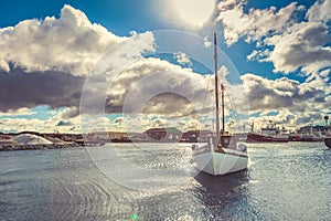 Fishing boat, swim to the dock, blue sky, cloud