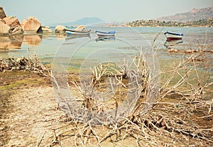 Fishing boat on the water of drying lake Buf, rural Turkey.