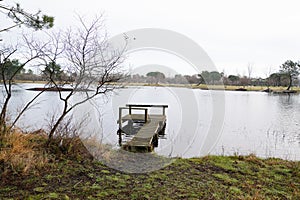 Fishing boat wood pontoon jetty Lake Hourtin in Gironde france