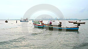 Fishing boats abstain from catching fish at sea cause storm and low tide