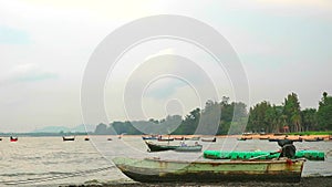 Fishing boats abstain from catching fish at sea cause storm and low tide