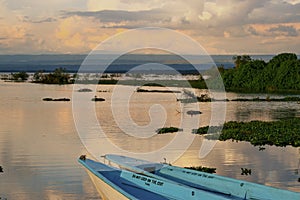 Fishing boats against a golden sunset at Lake Naivasha, Rift Valley, Kenya