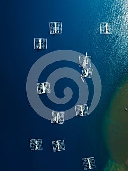 Fishing boats are at anchor in ocean on Sumbawa. Aerial view