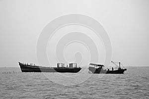 The fishing boats anchored on the open sea.