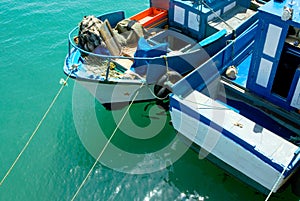 Fishing boats anchored over a clean turquoise water surface