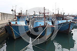 fishing boats anchored at the pier