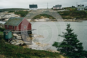 Fishing boats anchored and waiting in a secluded bay in Peggy's Cove, Nova Scotia, Canada - oct 2022