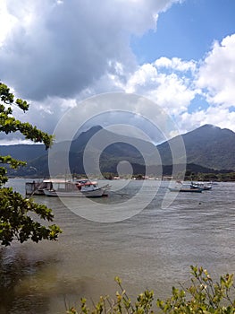 Fishing Boats in Bay Against Mountains