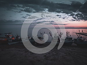 Some fishing boats at the beach of the Baltic Sea shortly befor sunrise