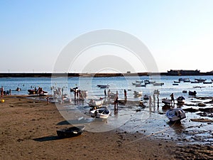 Fishing boats on the beach of La Caleta in the bay of the capital of Cadiz, Andalusia. Spain.