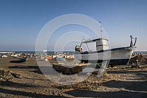 Fishing boats on the beach sand