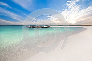 Fishing boats on the beach at sunrise time