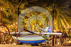 Fishing boats on the beach of tropical island Bali at night, Indonesia.