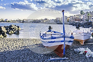 Fishing boats on the coast of the city of giardini naxos sicily