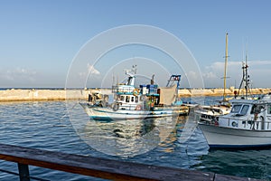 Fishing boats coming into the Jaffa - Namal Yafo port in Tel Aviv, Israel. Jaffa