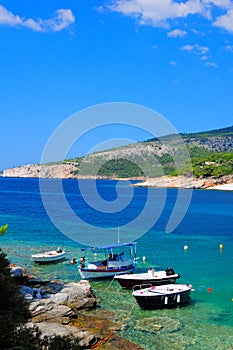 Fishing boats in a cove in Thassos island, Greece