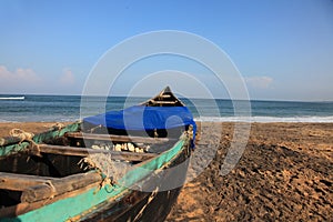 Fishing  boats docked on a beach