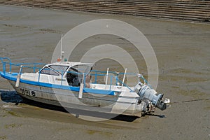 Fishing boats docked in mudflats