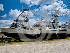 Fishing boats drydocked on land at the end of the fishing season