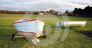 Fishing boats on field