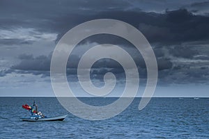 Fishing boats Float on the sea in dark sky and storm coming