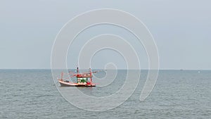 Fishing boats floating in the middle of the sea waiting to fish at Bang Lamung Sea, Chonburi