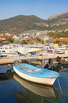 Fishing boats in harbor, beautiful Mediterranean landscape.  Montenegro, Bay of Kotor. View of Marina Kalimanj in Tivat city