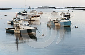 Fishing boats in a harbor Camp Ellis, Maine, on a summer day