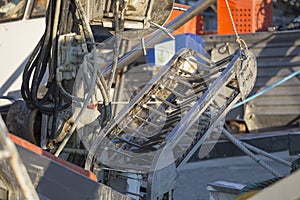 Fishing boats in harbor - machine for the processing of clams