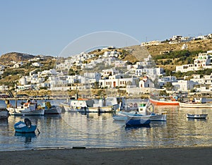 Fishing boats in the harbor of Mykonos at sunset