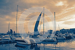 Fishing boats in harbor at sunset. Montenegro, Tivat. Color toning