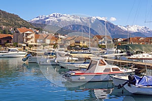 Fishing boats in harbor. View of Marina Kalimanj in Tivat city in winter, Montenegro