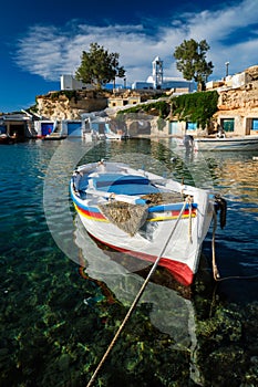 Fishing boats in harbour in fishing village of Mandrakia, Milos island, Greece