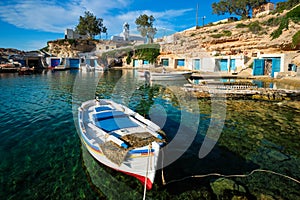 Fishing boats in harbour in fishing village of Mandrakia, Milos island, Greece