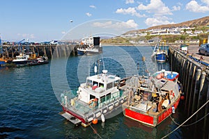 Fishing boats in harbour Mallaig Scotland uk port on the west coast of the Scottish Highlands near Isle of Skye in summer photo
