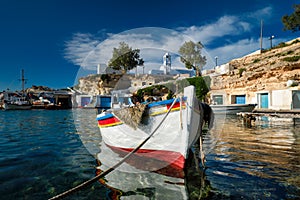 Fishing boats in harbour in fishing village of Mandrakia, Milos island, Greece