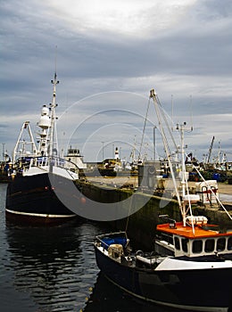 Fishing boats and the Lighthouse in the back ground, in Fraserburgh Harbour,Aberdeenshire,Scotland,UK.