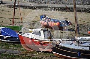 Fishing Boats at Low Tide in Mousehole Harbour, Cornwall