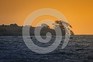 Fishing boats in the middle of the lake at sunset. Lake Victoria,Tanzania