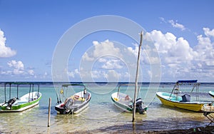 Fishing boats moored along the coast in Costa Maya, Mexico, on the Yucatan peninsula