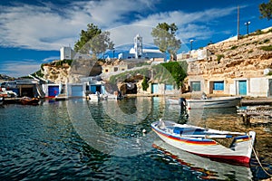 Fishing boats in harbour in fishing village of Mandrakia, Milos island, Greece