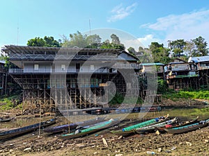 Fishing boats are moored on the edge of a reservoir