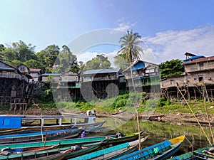 Fishing boats are moored on the edge of a reservoir