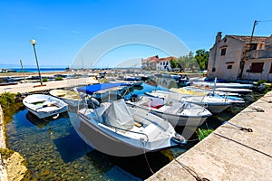 Fishing boats moored in harbor or port on Silba, Croatia.