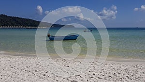 Fishing boats moored off paradise beach Koh Rong Samloem Cambodia