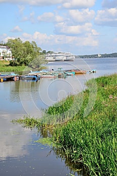 Fishing boats and motor ships in Volga river in summer, Russia. photo