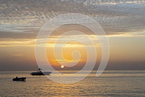 Fishing boats in the ocean. Fog in ocean at dawn. Copy space.