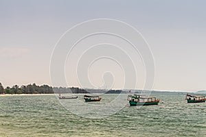 Fishing boats off Ochheuteal Beach in Sihanoukville Cambodia